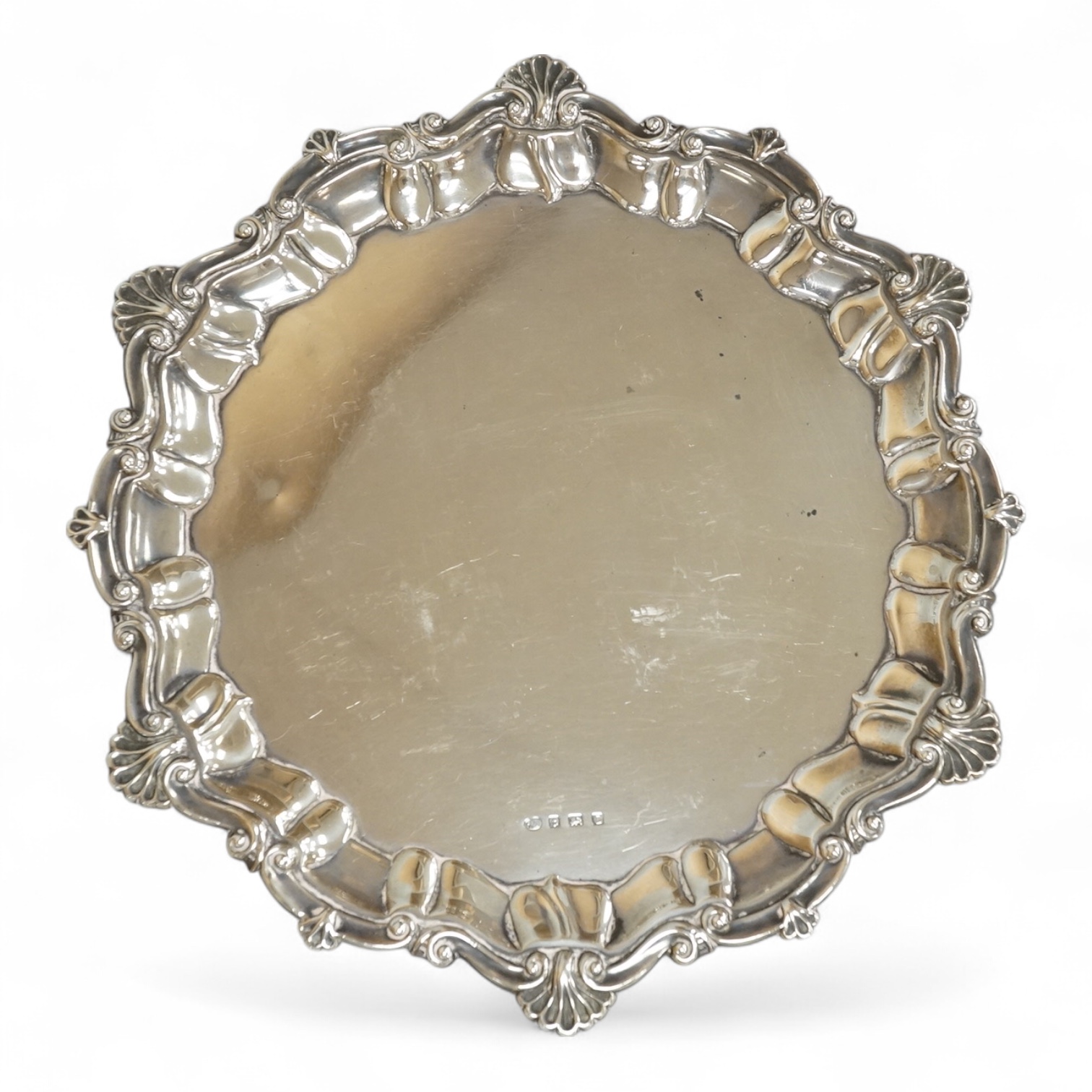 A George V silver salver by Alexander Clark & Co Ltd, of shaped circular form, with shell and scroll border, Birmingham, 1931, 27cm, 16oz.